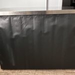 Table inox 120 × 60 cm avec habillage noir, vue de face